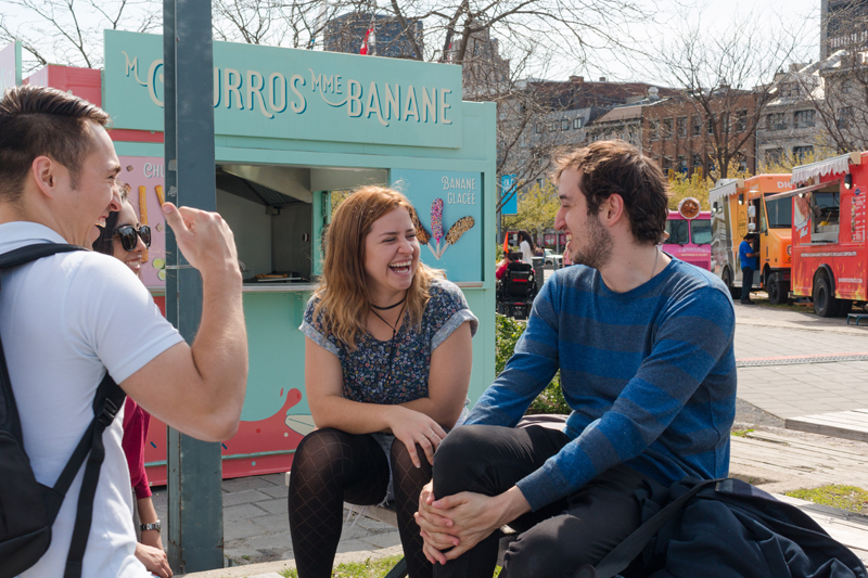 Students studying English in Montreal socialising after class