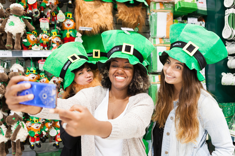 English students taking a selfie wearing St Patrick's hats, Dublin 