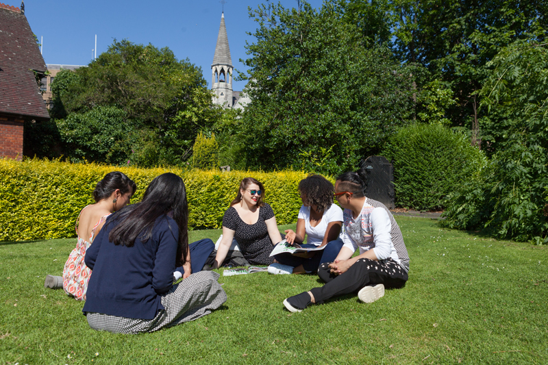 Young people resting at a garden in Dublin, EC students