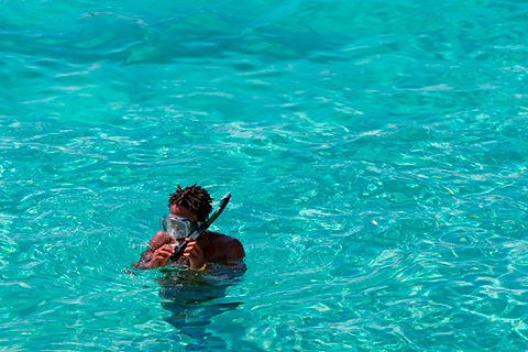 English student snorkeling in Malta's turquoise water