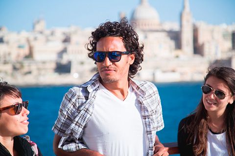 Small group of english students visiting Sliema and enjoying great views of Valletta