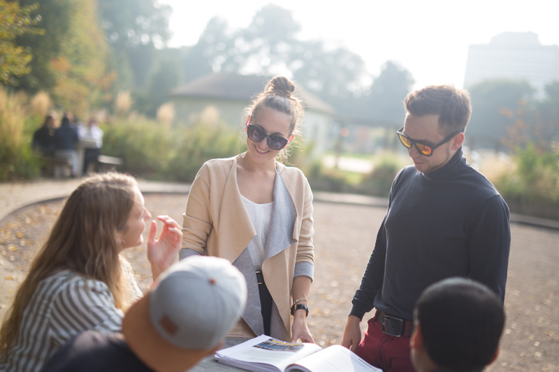 Students studying English at the EC school in Brighton outside in the sun