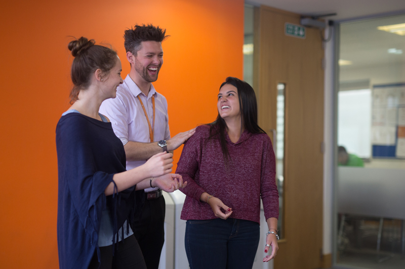 English students talking to their teacher at EC Brighton School