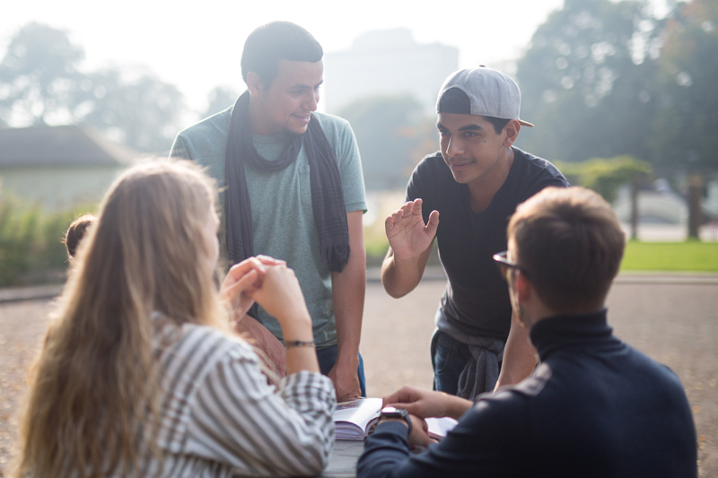 Students studying English together and discussing their English lesson topics in Brighton 