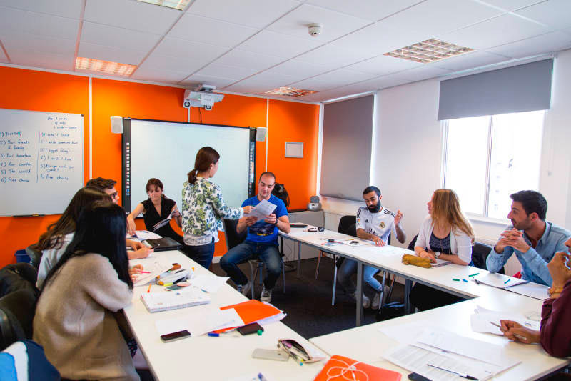 English class in Bristol at EC which shows the Engish teacher helping students improve their English