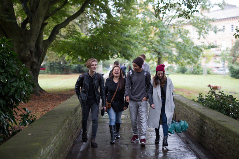 Students studying English in Bristol at EC language school, enjoying their free time walking in the park