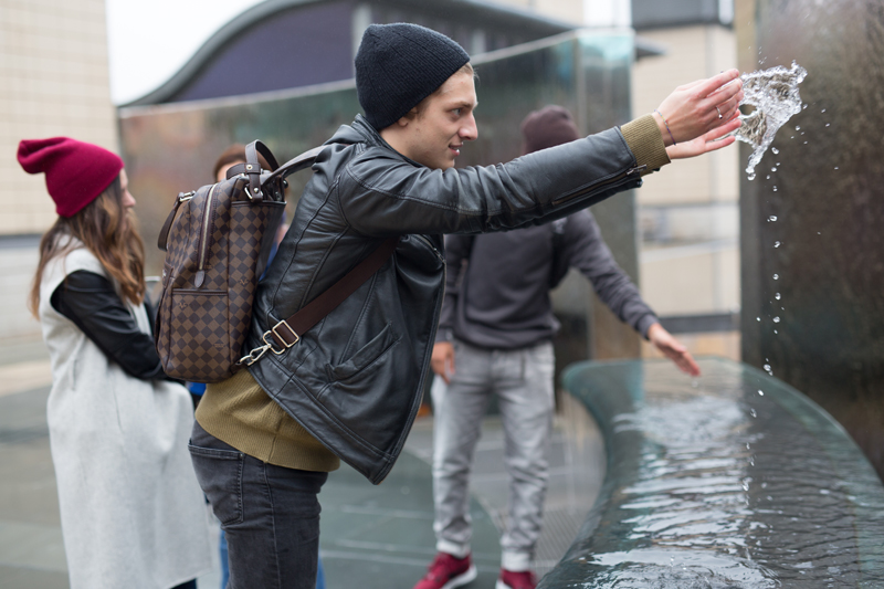 English Student of EC playing with water in Bristol