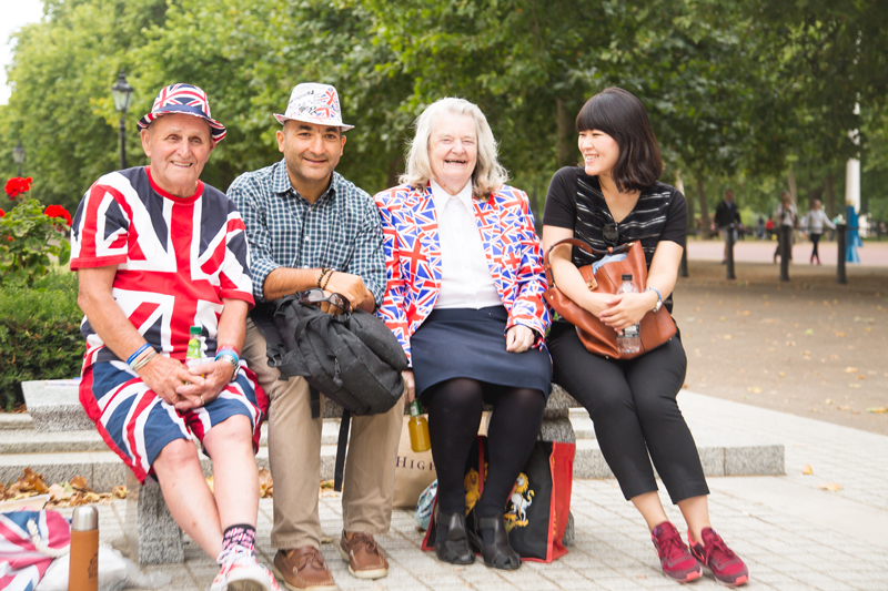 In love with UK, international students with lovely couple in a park in London