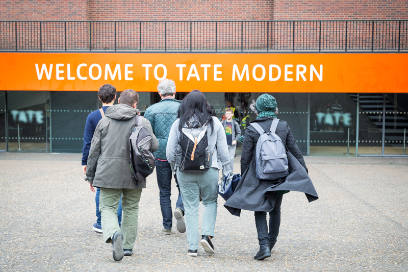 Adult english students arriving to Tate Modern in London