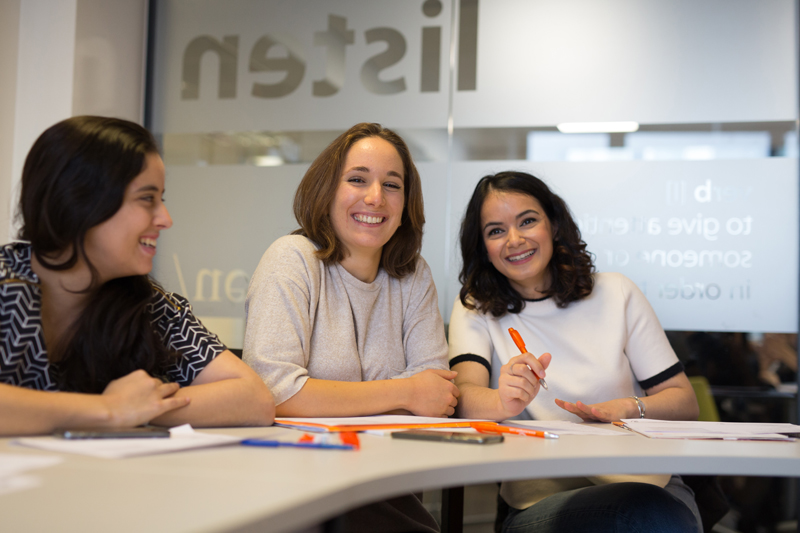 Students happily smiling during an English Course at EC English school in London