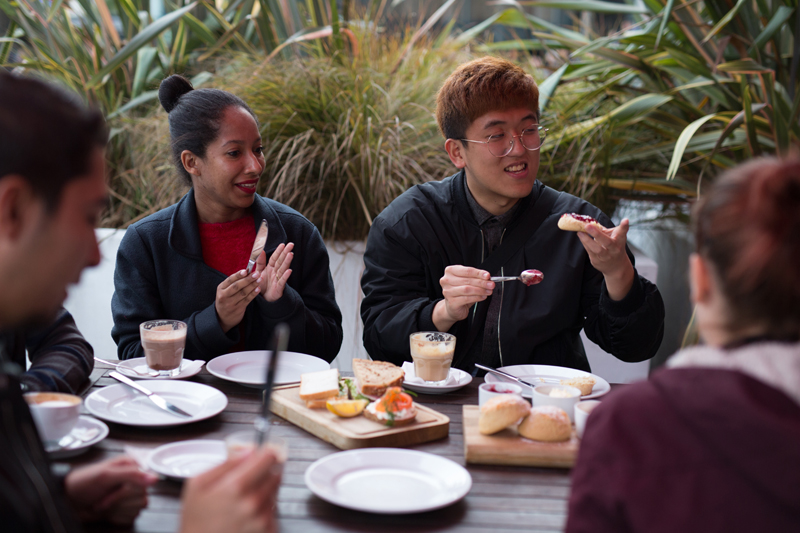Happy EC Students enjoying breakfast in London before heading to their English course
