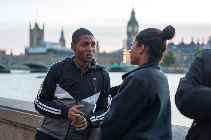 People interacting in-front of Big Ben in London