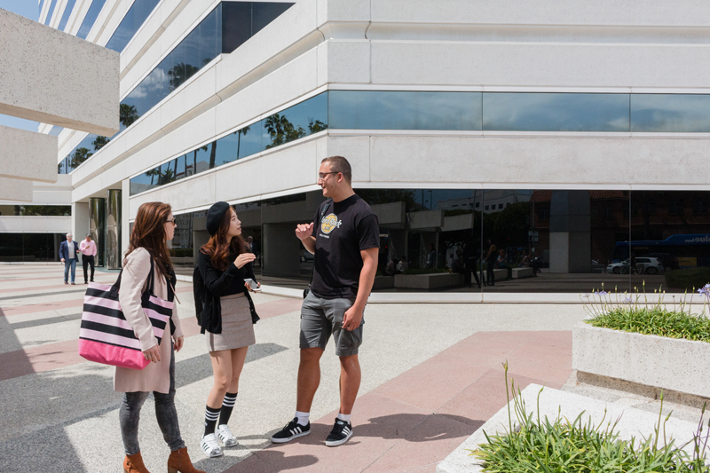 Language students taking the LA English Course in Los Angeles at EC practicing their conversation skills outside