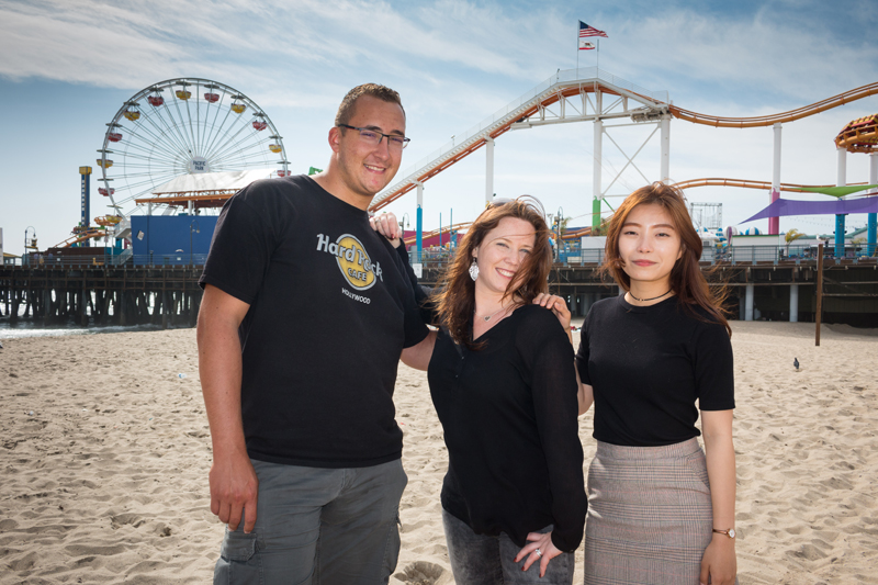 International students learning English at EC in Los Angeles outside near the fair