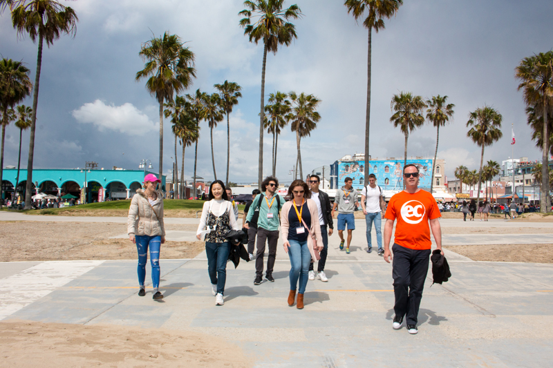 EC English School LA leader with signature Orange T-shirt guiding language students on an excursion