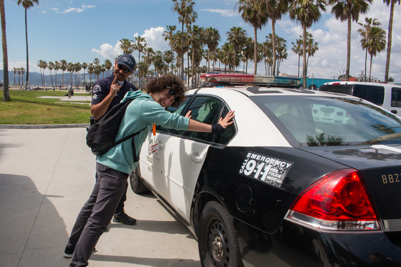 EC English students joking around with an LAPD Cop and his car in Los Angeles