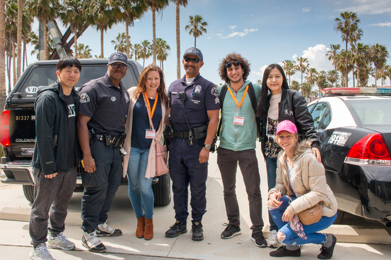 EC students taking a photo outside on a sunny day at the EC school in LA